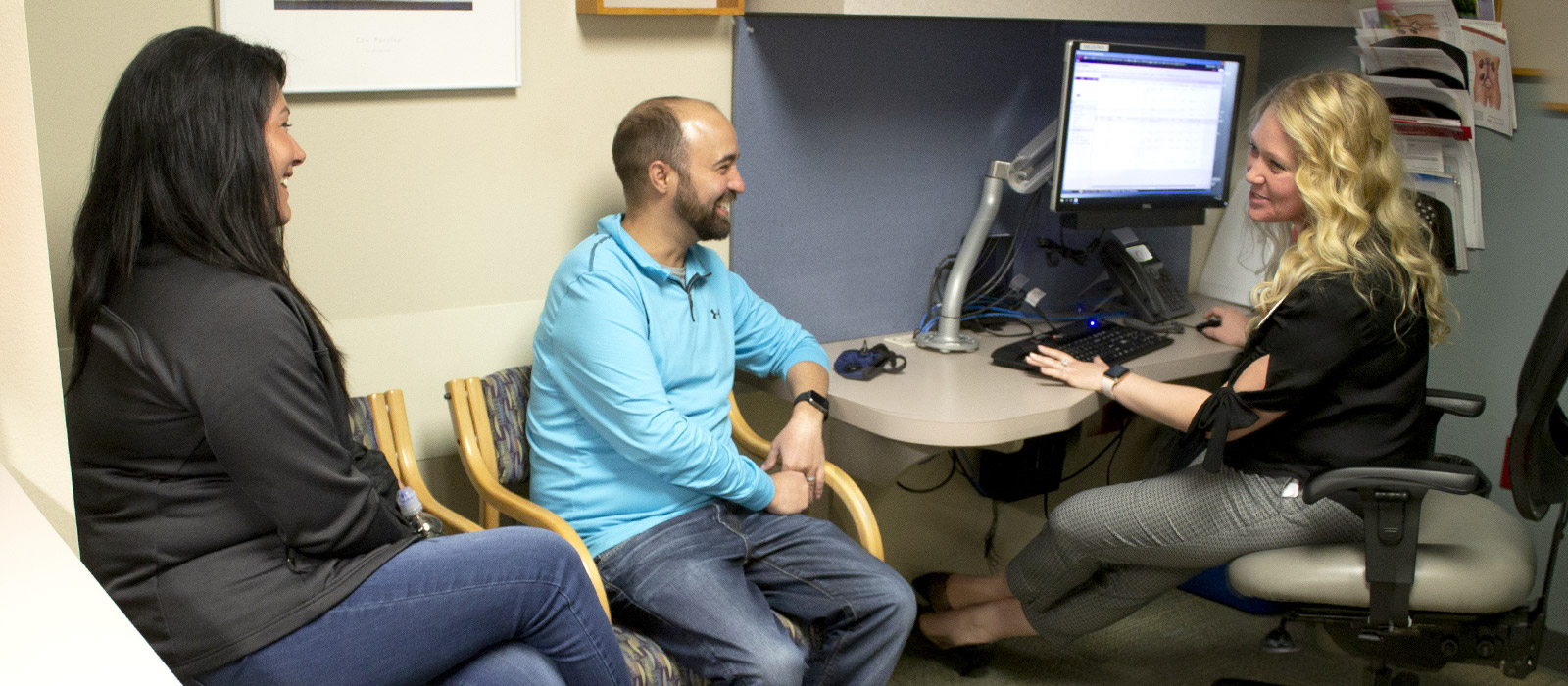 A 4th year pharmacy student on a rotation in the transplant clinic discusses medications with a patient